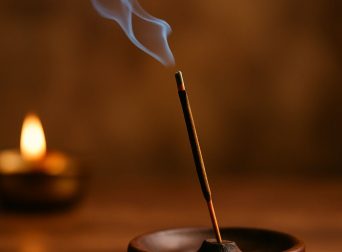 What is the significance of burning incense sticks?